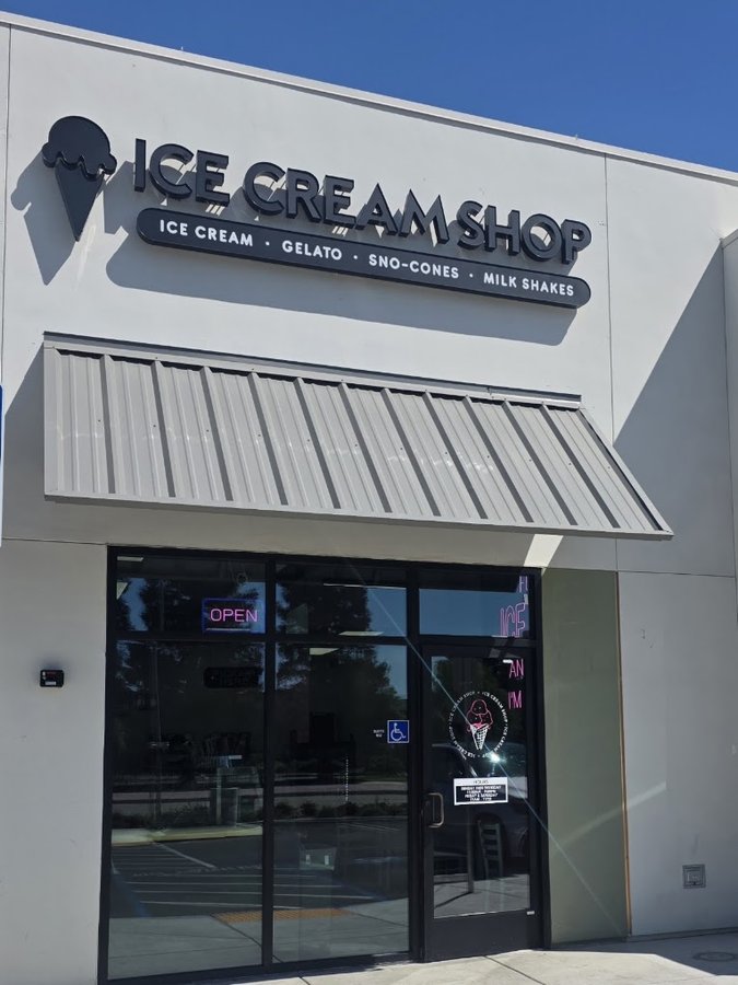 The Ice Cream Shop storefront with balloon arch